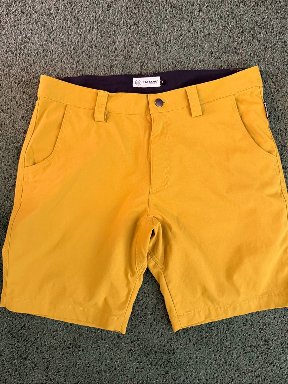 Flylow Hybrid Shorts in yellow/khaki stretch nylon